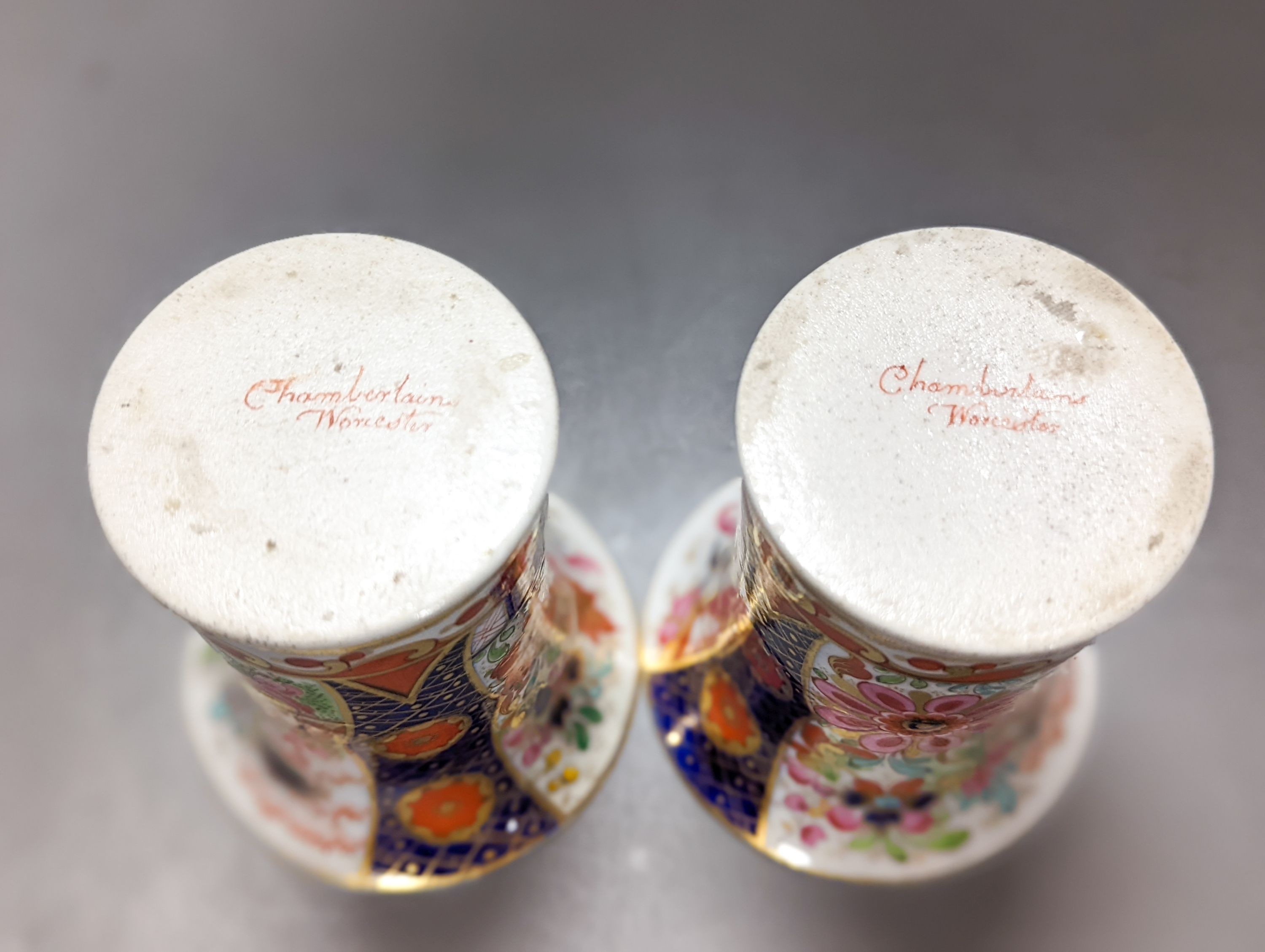 A pair of Chamberlain's Worcester miniature vases and Barr, Flight & Barr Worcester tea cup and saucer, early 19th century